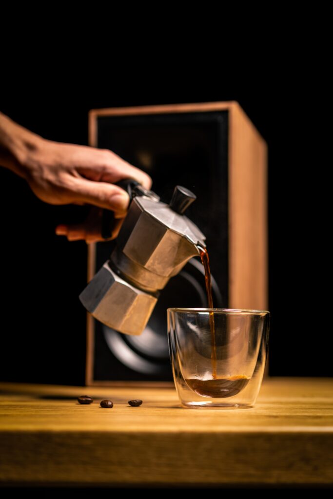 Freshly Brewed Coffee Pour - Elegant Metal Kettle & Beans Wallpaper