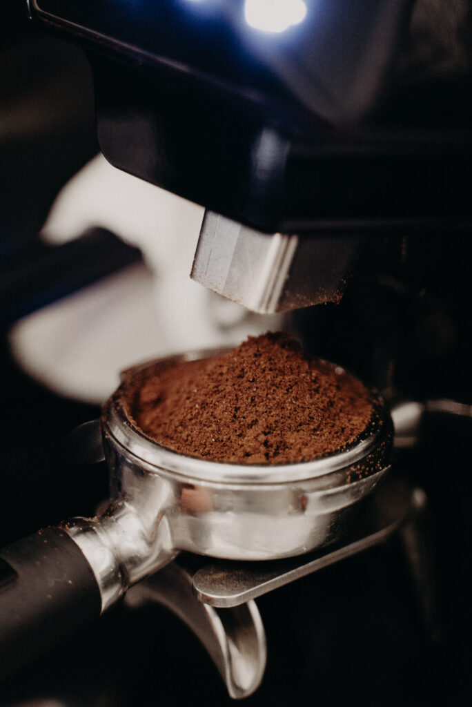 Rich Brown Coffee Powder in Portafilter - Perfect Brewing Wallpaper