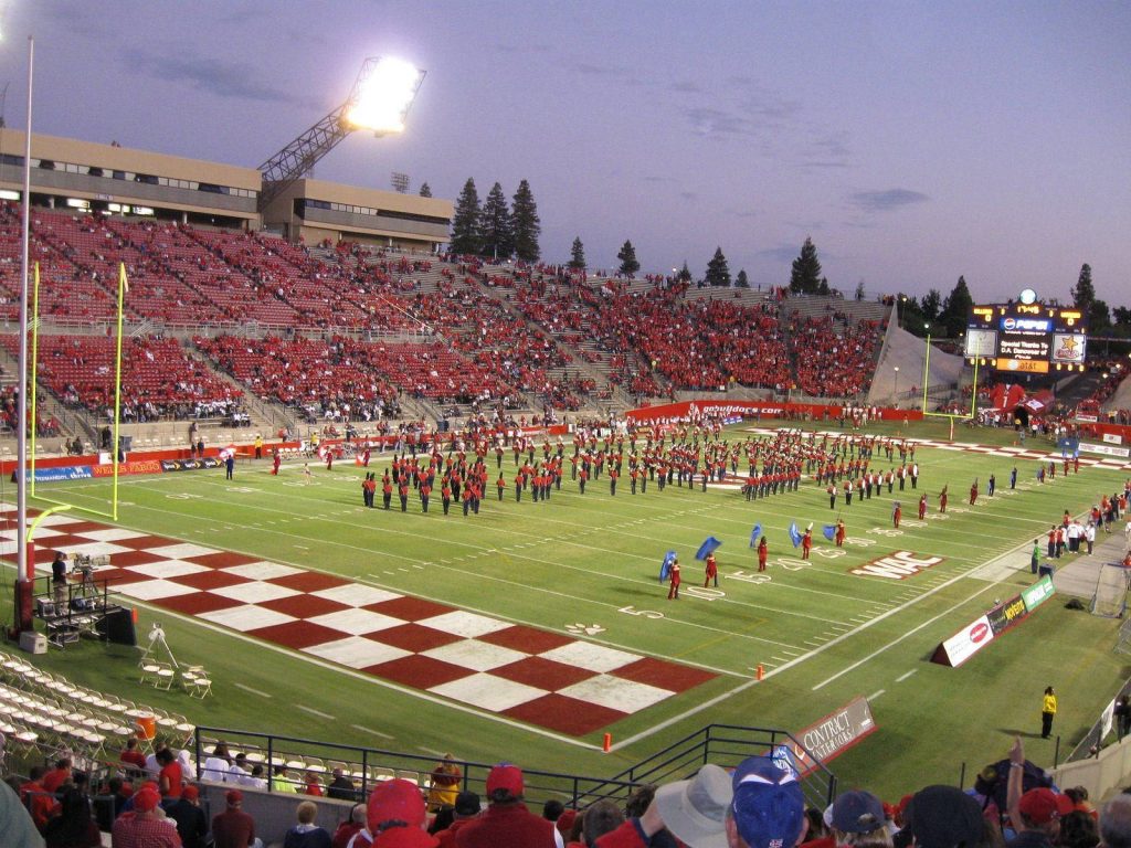 Fresno State Bulldog Stadium football game with marching band on checkerboard turf at twilight Wallpaper