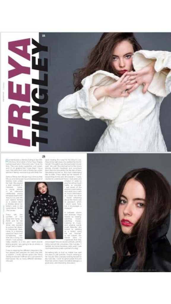 Actress Freya Tingley in stylish white top black patterned outfit and bold red lipstick portrait Wallpaper