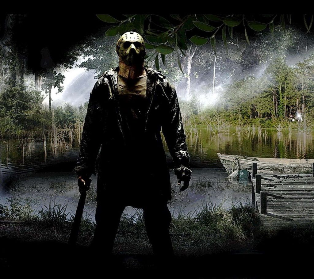 Jason Voorhees with hockey mask and machete over misty dark Crystal Lake spooky horror wallpaper