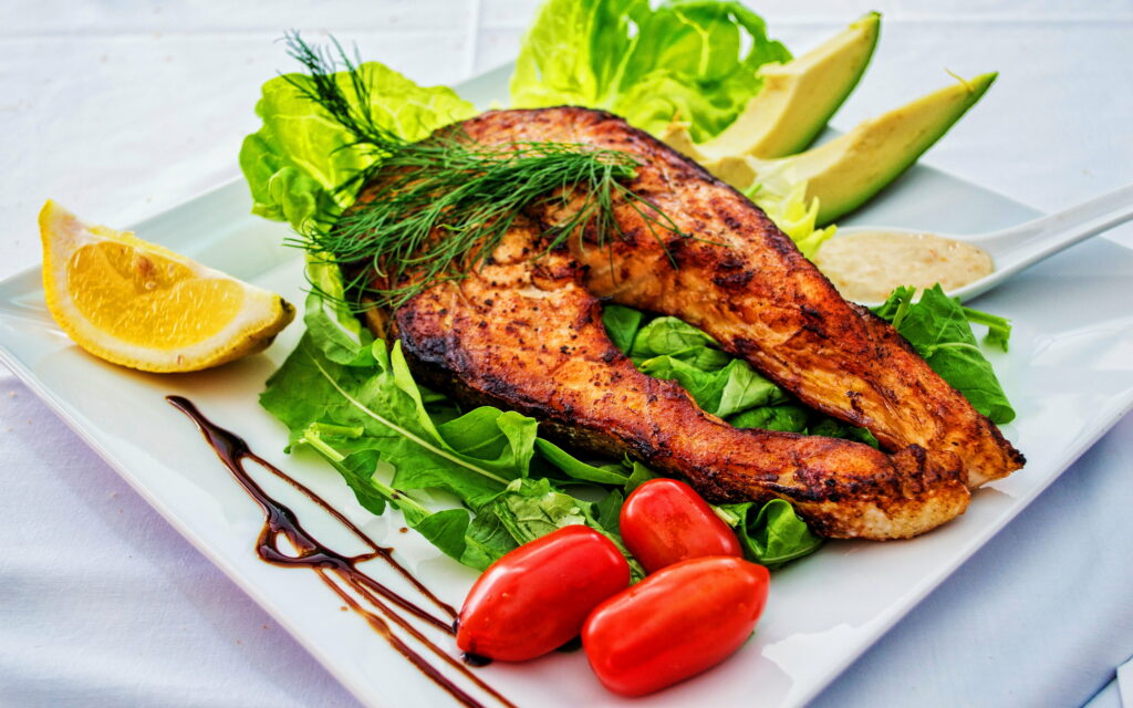 Sizzling Seafood Delight: Appetizing Fish Steak with Colorful Vegetables - HD Food Wallpaper