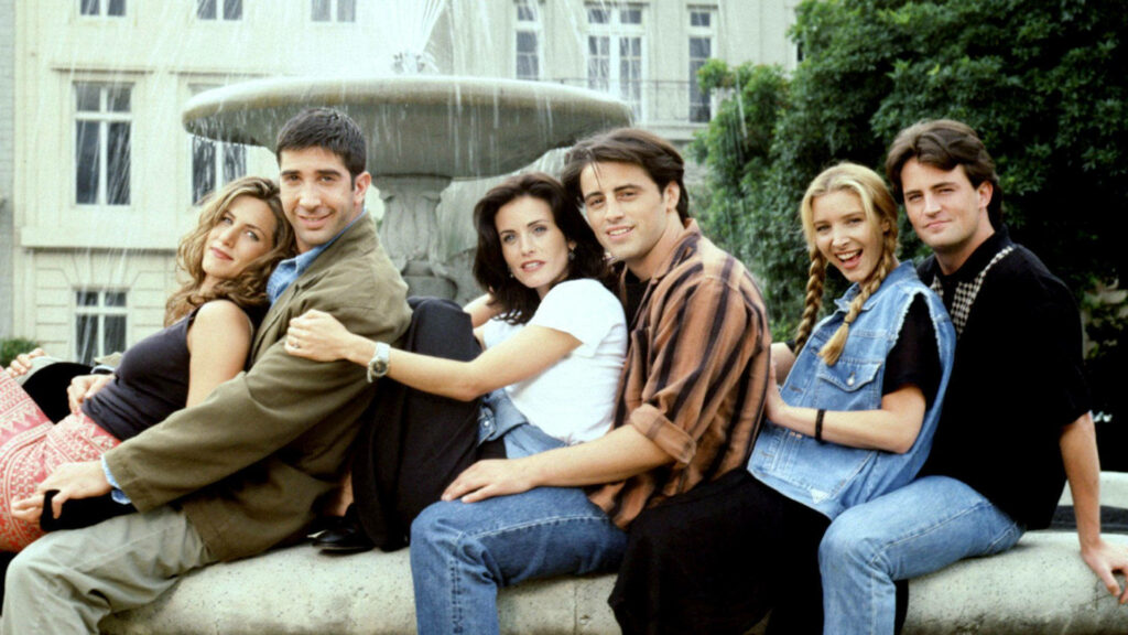 Friends Sitcom Wallpaper: Iconic Cast by Fountain - Vibrant Background
