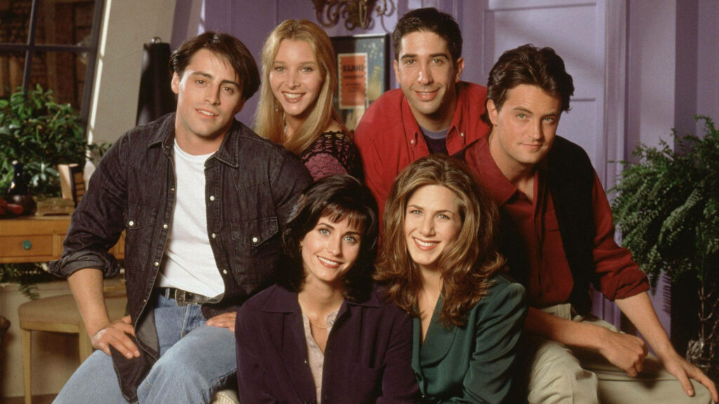 Friends TV Show Wallpaper: Iconic Cast in Cheerful Group Pose