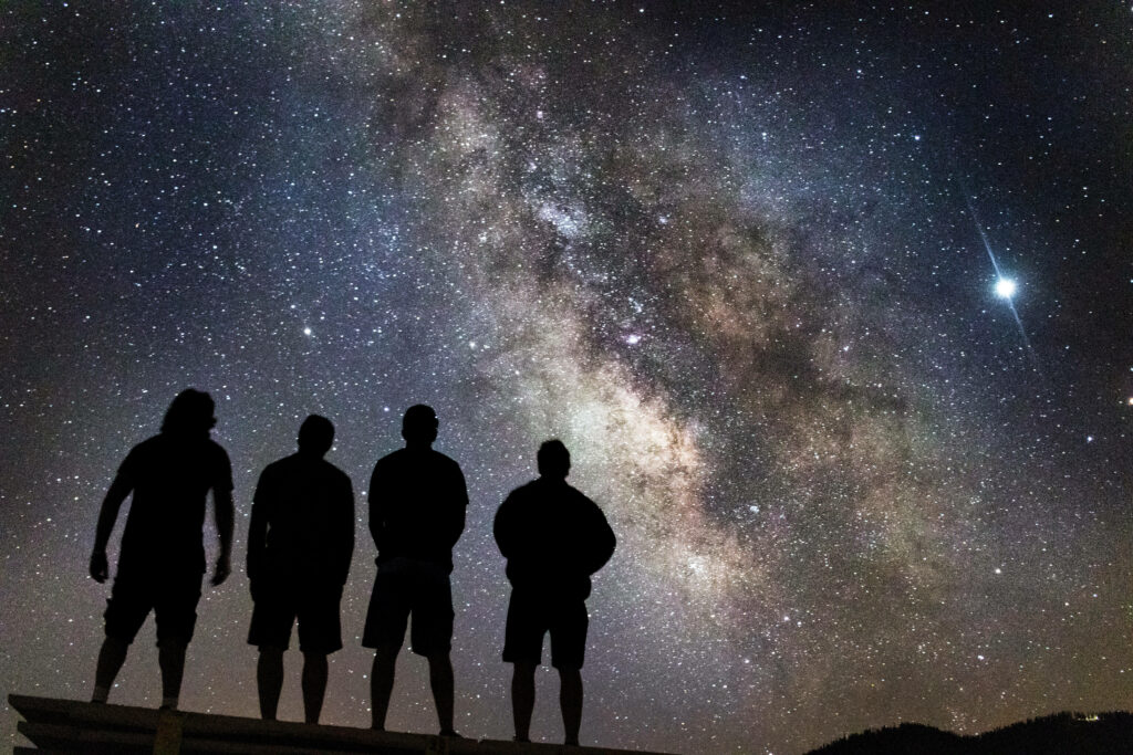 Enchanting Stargazing with Best Friends Wallpaper
