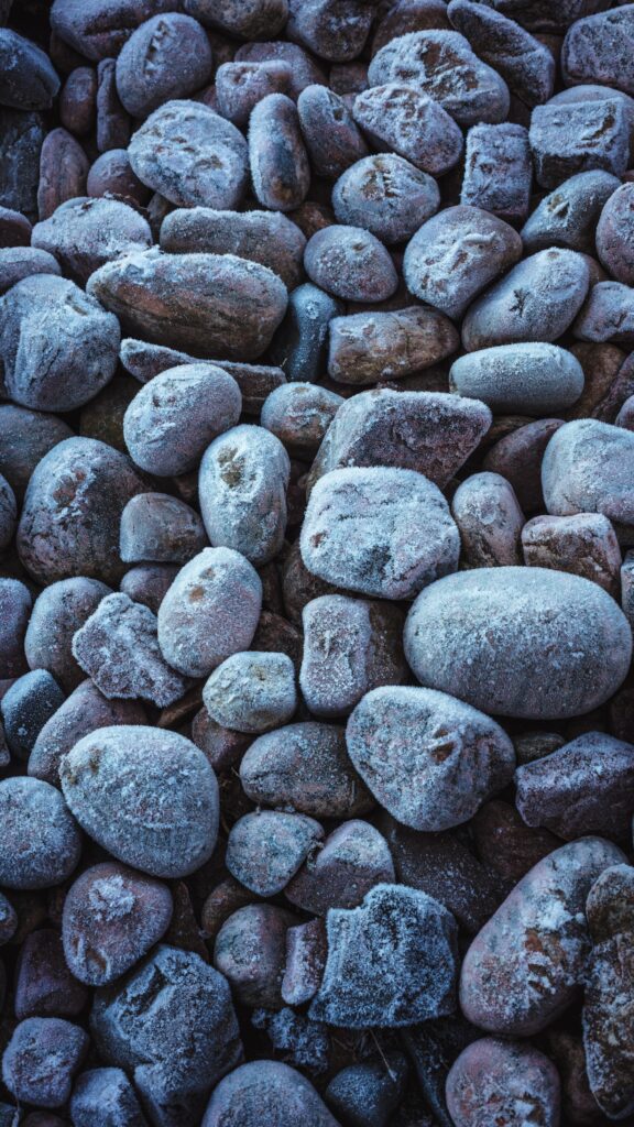 Frost-Covered Gray Stones Texture: Serene Nature Wallpaper Background