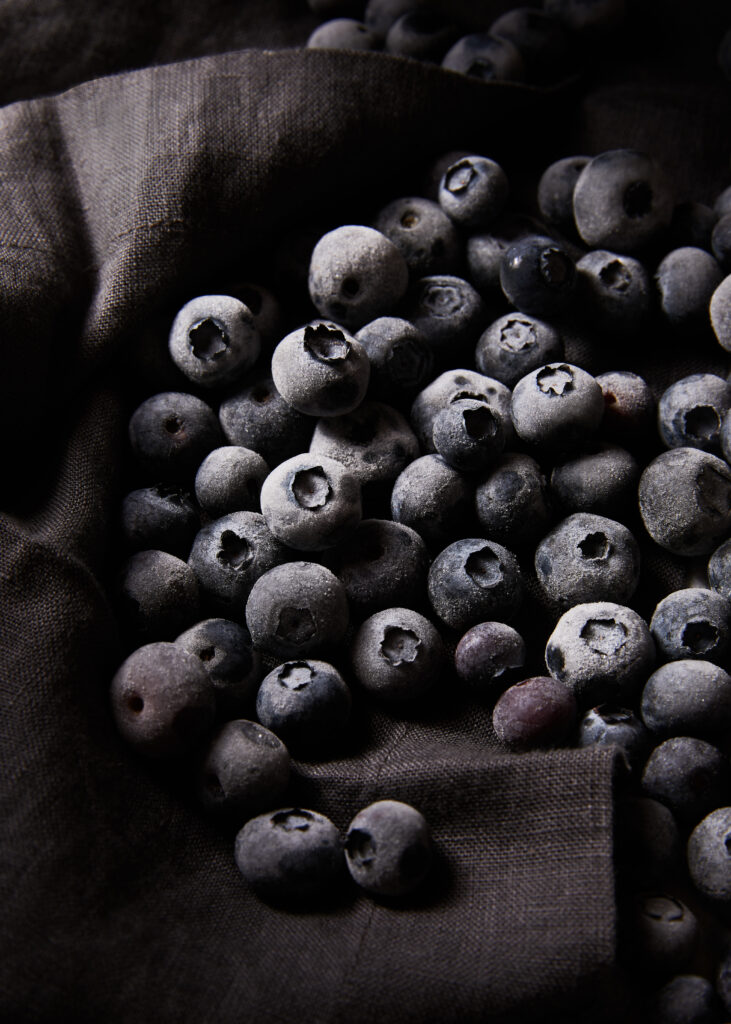 Frosted Blueberries Close-Up on Dark Fabric Wallpaper Background