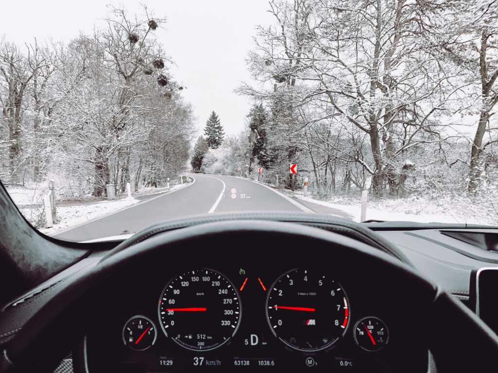 Winter Wonderland: Breathtaking View of Frosted Trees & Serene Road from BMW X5 Car Window Wallpaper