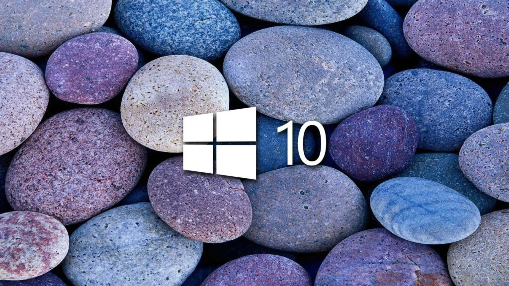 Chilly Serenity: A Captivating HD Image of Windows 10 Logo Embracing a Cold-Colored Stack of Stones Wallpaper