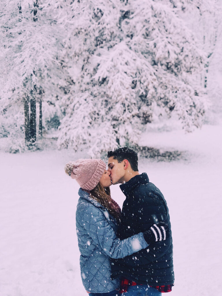Serenading Snowflakes: Embracing Passion in a Winter Wonderland Wallpaper