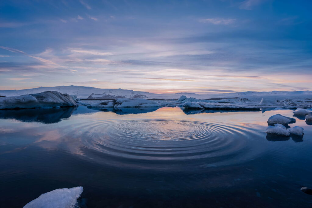 Frozen Horizons: Majestic Waters Reflecting Snowy Circles - Captivating 8K Wallpaper Background