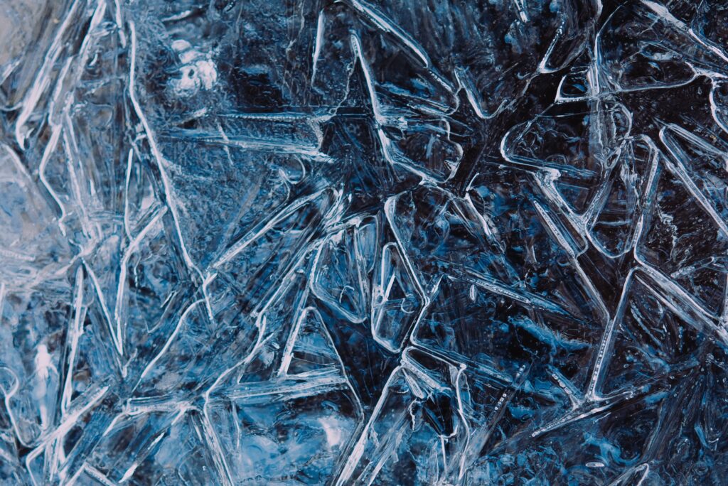 Intricate Blue Ice Wallpaper: Captivating Frozen Texture Background