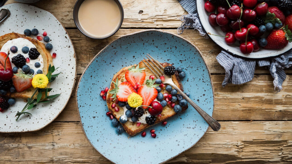 Drool-Worthy Delights: Tempting French Toast Bliss with a Medley of Fruits Wallpaper