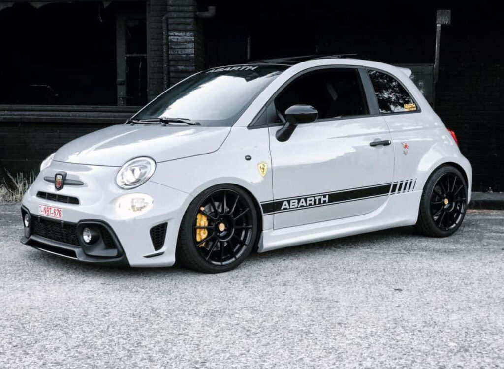 High-Octane Marvel: Abarth 595 Unleashes its Unrivaled Brilliance on an Endless Highway Wallpaper