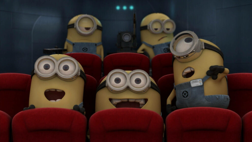 Playful Minions Movie Theater Wallpaper - Lively Desktop Background