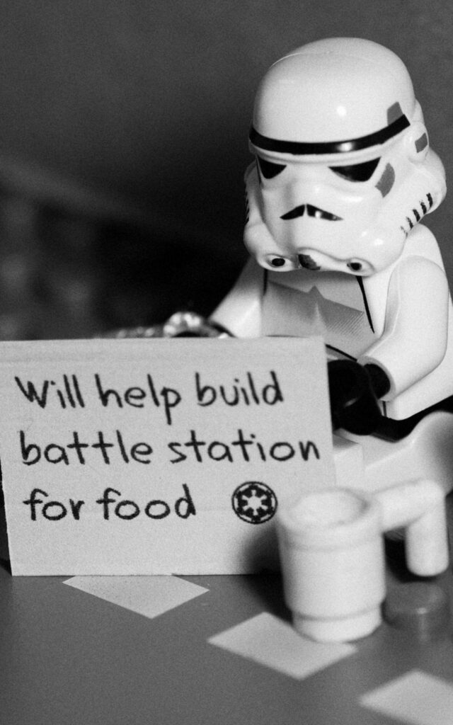 LEGO Star Wars wallpaper with Stormtrooper holding sign offering help to build battle station