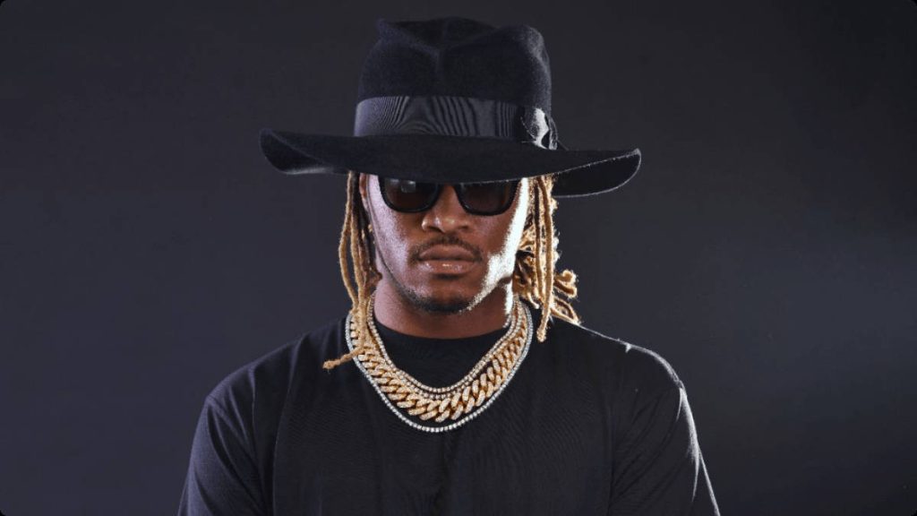 Future rapper studio portrait with black hat sunglasses gold chains moody background wallpaper