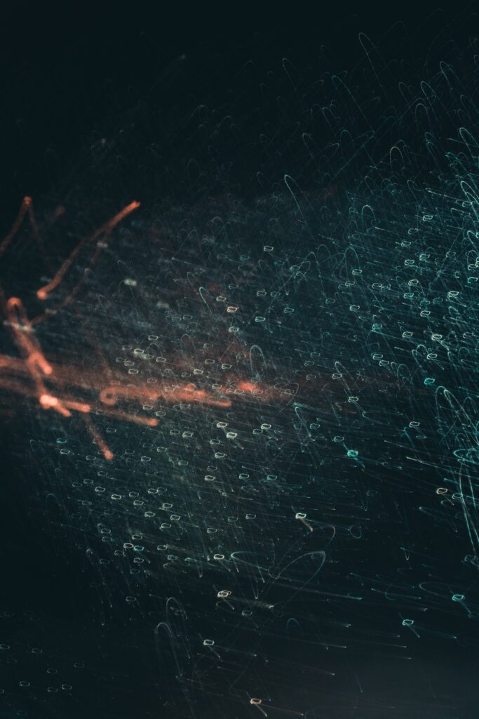 Futuristic Abstract Wallpaper: Dynamic Light & Pattern on Dark Background