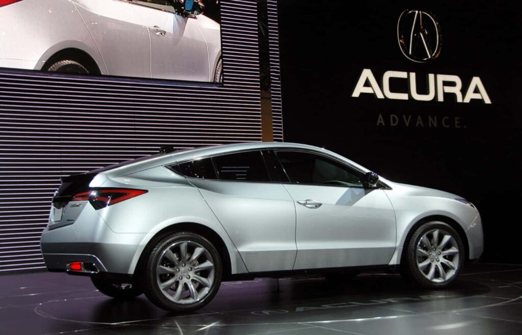 “Futuristic Acura: Luxury Vehicle Showcase on Modern Stage Wallpaper”