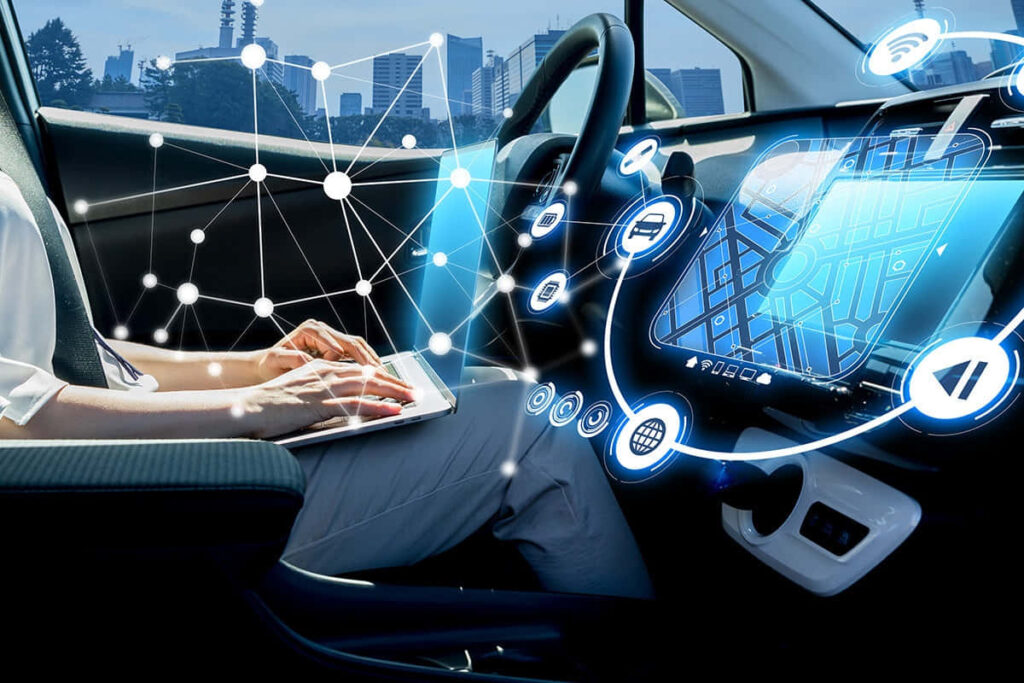 Futuristic Automobile Dashboard Display with Modern Cityscape Wallpaper