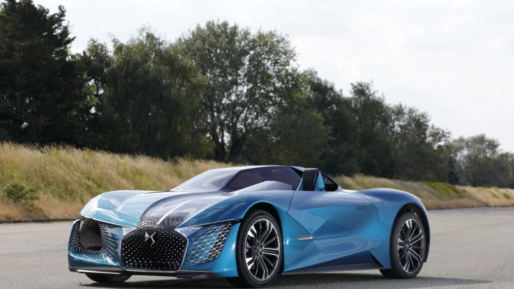 Futuristic blue DS Automobiles concept car with sleek aerodynamic lines in natural outdoors Wallpaper