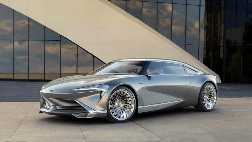 Futuristic Buick Wildcat with metallic finish and alloy wheels against modern architecture wallpaper