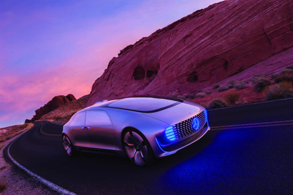 Futuristic Car with Advanced Tech on Sunset Desert Road - Wallpaper