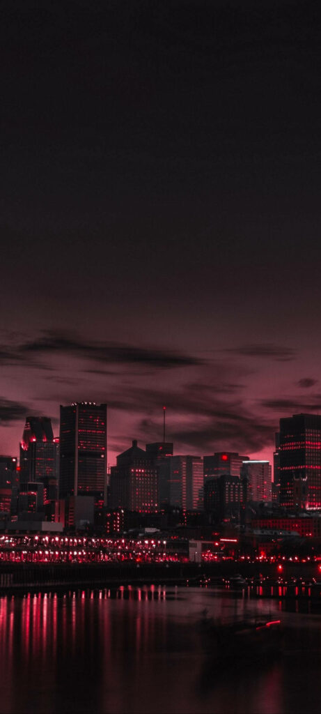 Futuristic Cityscape Wallpaper: Vibrant Red Neon Lights at Twilight
