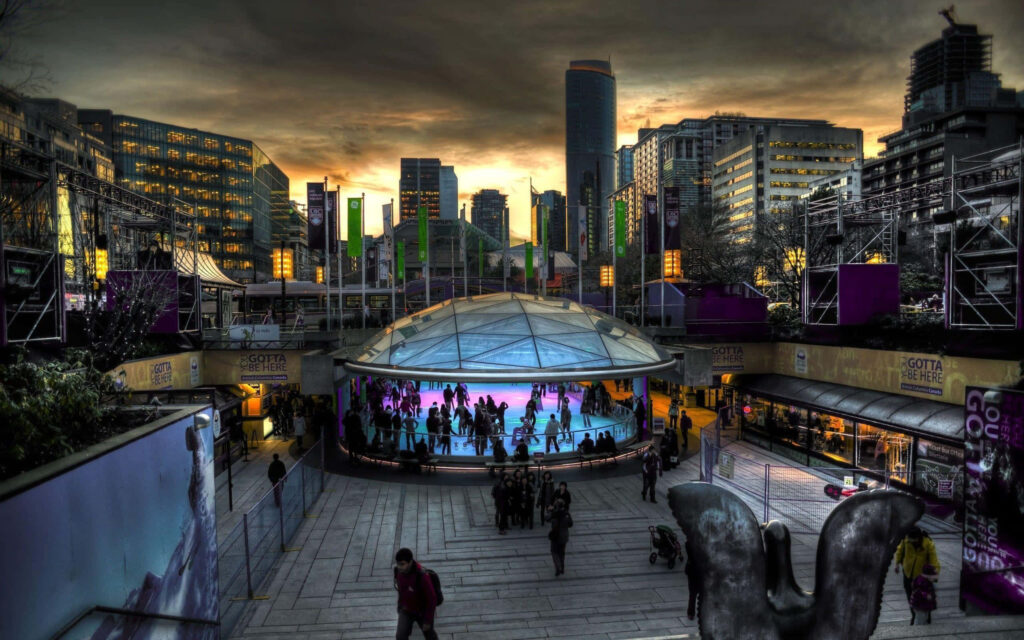 Futuristic Cityscape Wallpaper: Vibrant Lights Under Dramatic Skies