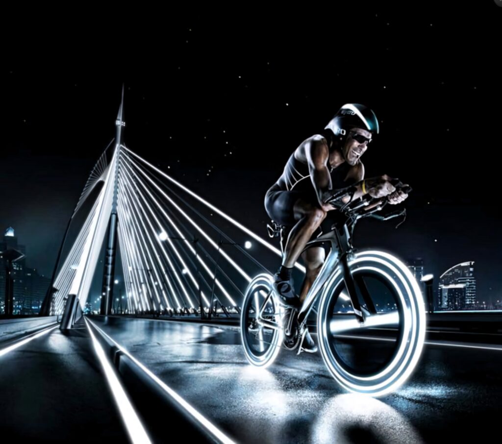 Futuristic cyclist rides neon-lit city bridge at night showcasing speed and urban energy wallpaper
