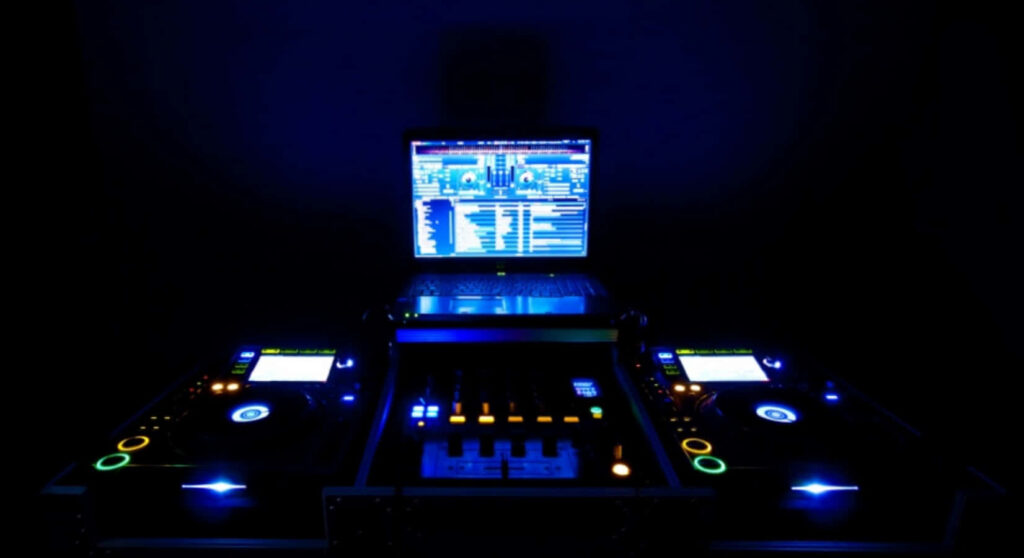 Futuristic DJ Setup: Glowing Console & LED Lights Wallpaper