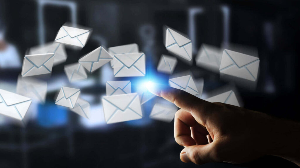 Hand reaching glowing email envelopes digital communication technology dark background wallpaper