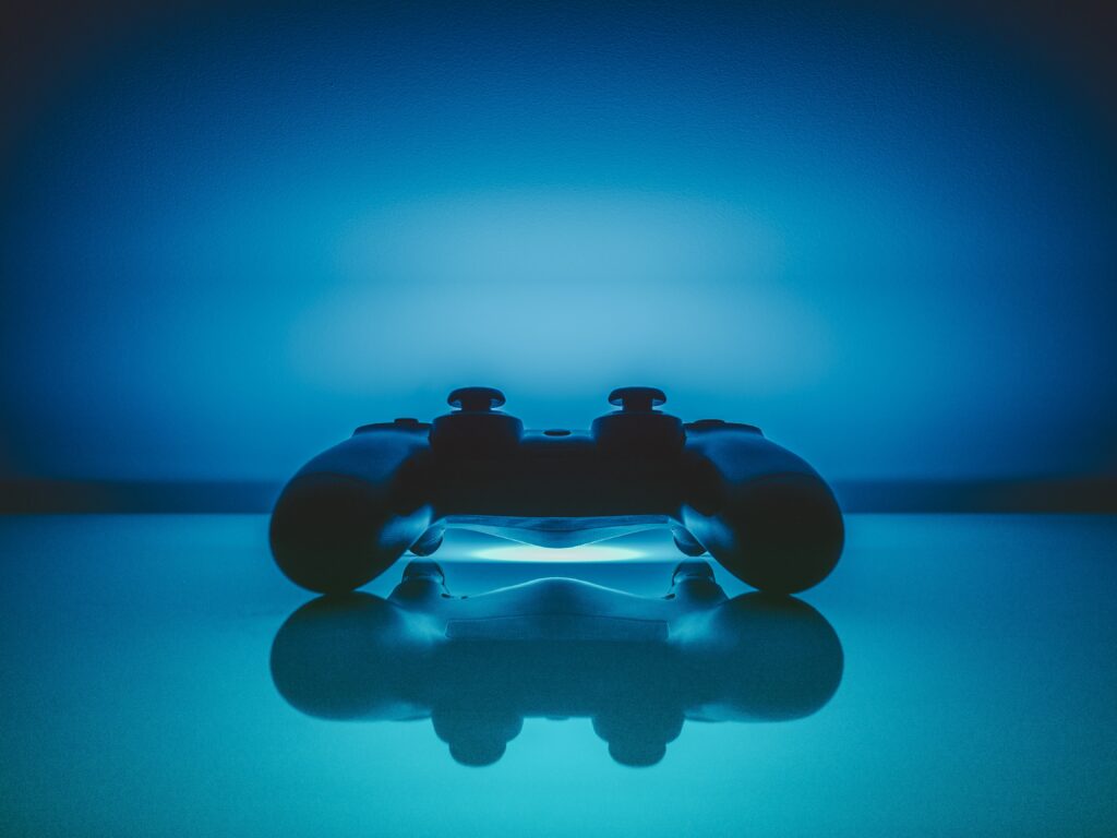 Futuristic Gaming Controller Wallpaper with Glowing Blue Light