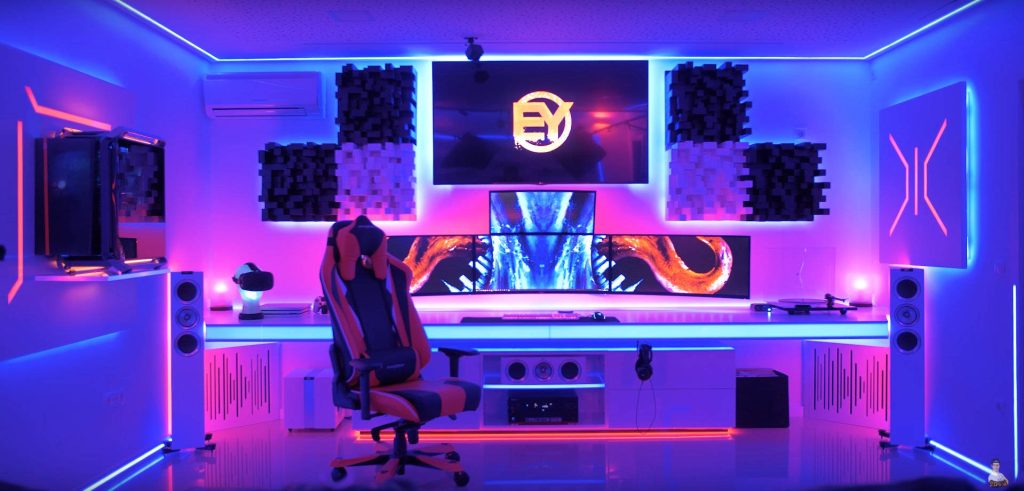Futuristic gaming room with triple monitors vibrant purple blue RGB lighting and racing chair background Wallpaper