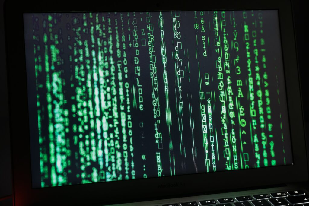 Futuristic Laptop Wallpaper: Matrix-Style Green Code Design