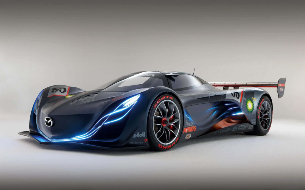 Futuristic Mazda Rx8 concept car with sleek aerodynamic lines and glowing blue accents wallpaper