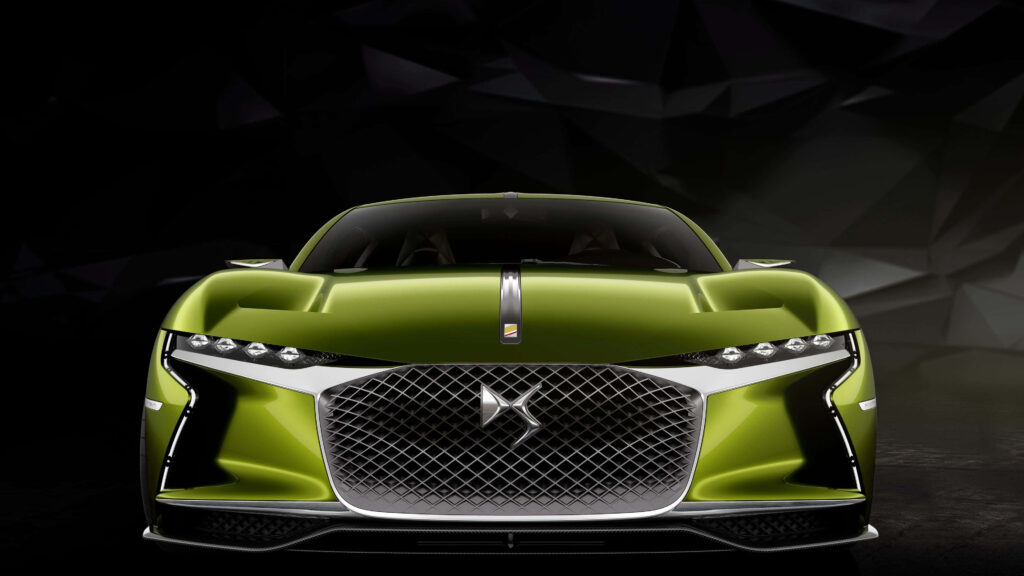Futuristic metallic green DS Automobiles car with chrome grille and sharp LED headlights wallpaper