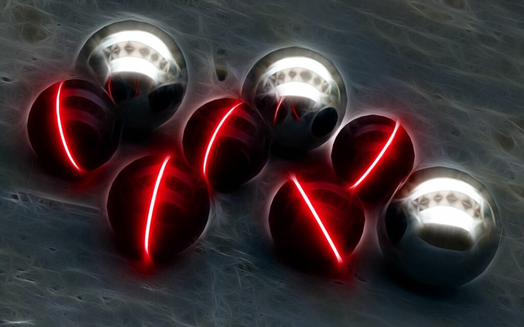 Futuristic Metallic Spheres with Radiant Glow on Dark Background Wallpaper