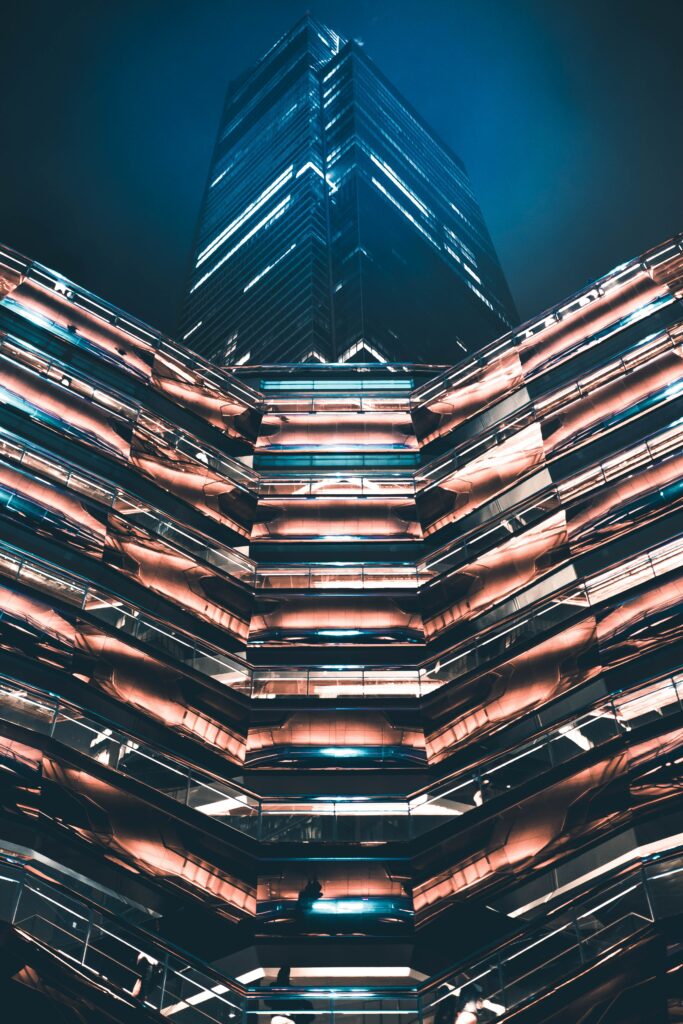 Futuristic Night Wallpaper: Modern Building with Glowing Lights