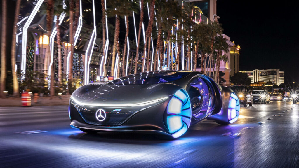 Glimpse into the Future: Nighttime Drive with Mercedes Benz's Futuristic Car Wallpaper
