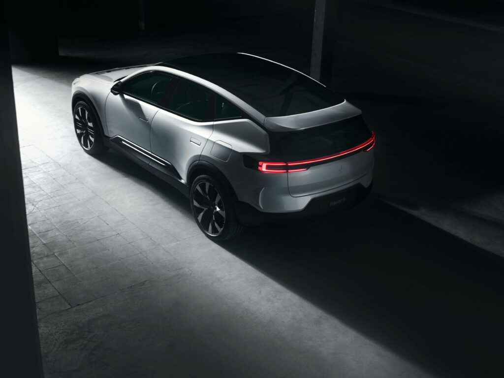 Polestar electric car rear view with futuristic LED lightbar in modern industrial setting wallpaper