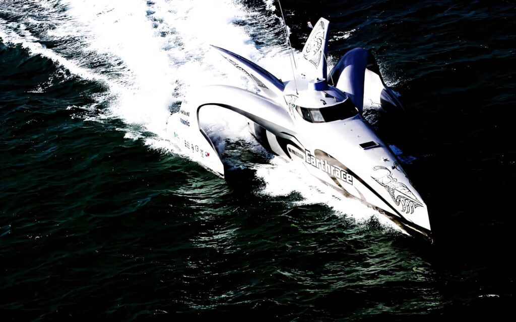 Futuristic powerboat cutting through dark blue waves with white spray on water wallpaper background