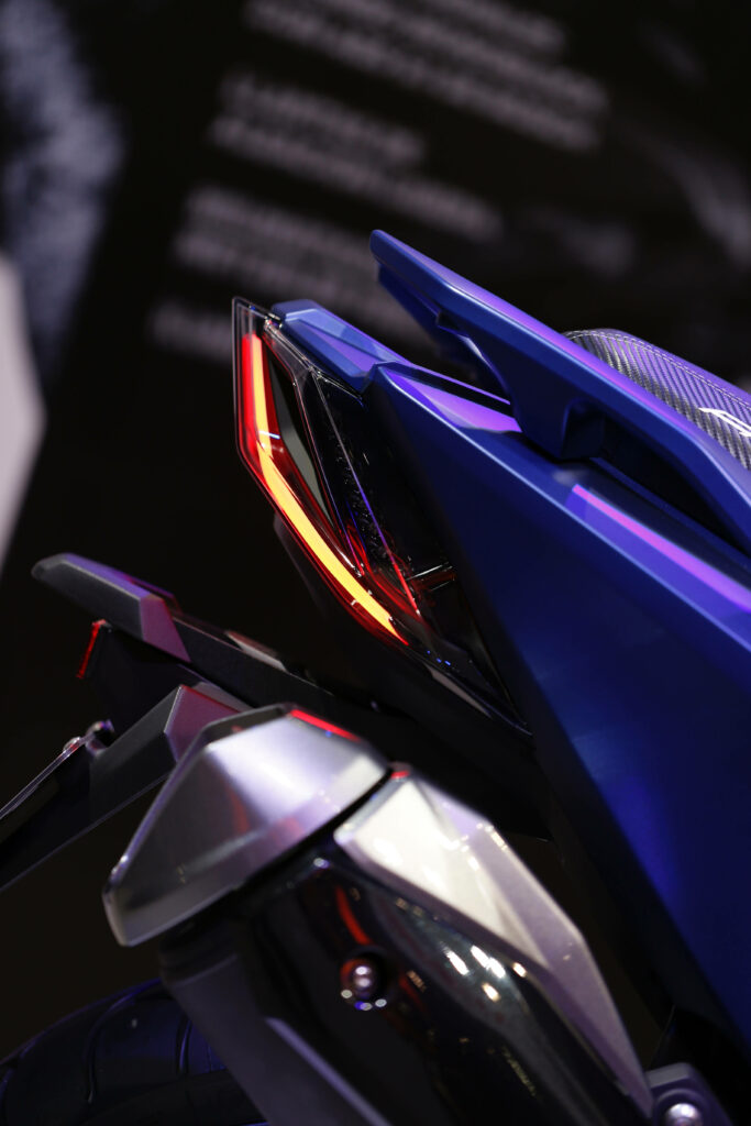 Sleek Purple Motorcycle Wallpaper: Futuristic Design & Tail Light Glow