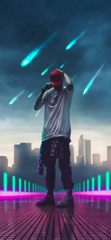 Stylish rapper in red cap on neon platform with cyan shooting stars over dark city skyline wallpaper