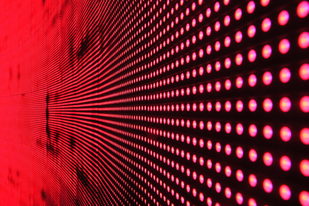 Futuristic Red Dot Matrix Wallpaper: Dynamic Tech-Inspired Background