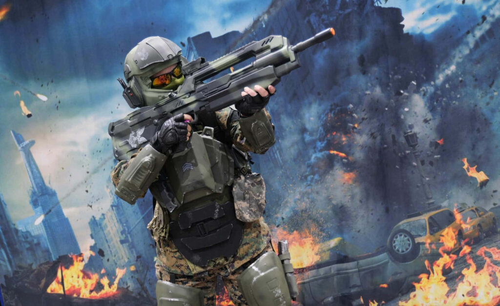 Futuristic Soldier in Fiery Urban Battleground - Dynamic 3D Wallpaper