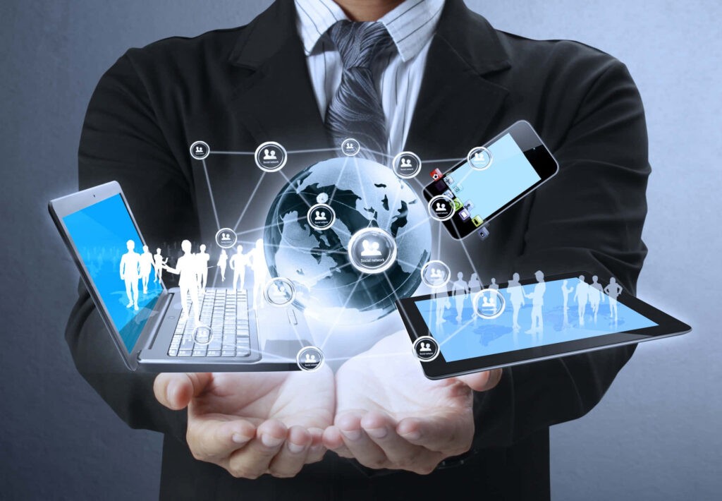 Futuristic Technology Integration: Businessman with Digital Devices & Holograms Wallpaper