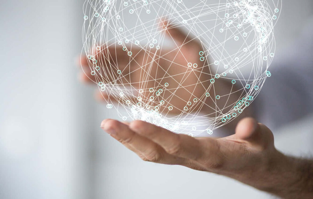 Futuristic Wallpaper: Hands Holding a Glowing Global Network