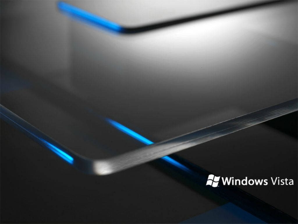 Abstract futuristic Windows Vista wallpaper layered glass plates glowing blue light black background