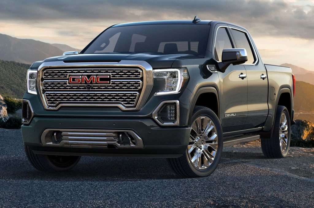 GMC Sierra 1500 Denali truck at sunset with mountain backdrop chrome accents premium wallpaper